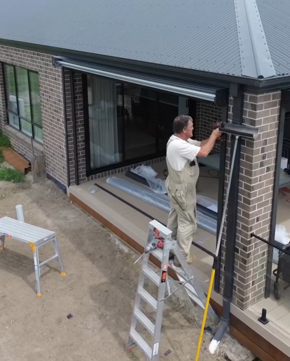Chris installing shutters on a new build home
